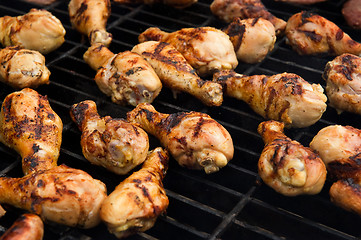 Image showing Chicken cooking on a grill