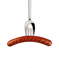 Image showing Pork sausage with fork isolated on a white background