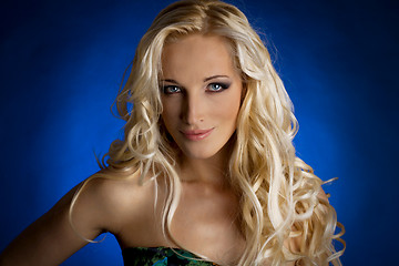 Image showing Portrait of a smiling blond lady with a beautiful hair