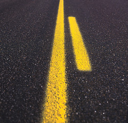 Image showing Asphalt road texture with yellow stripe