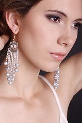 Image showing beautiful elegant girl with an evening make-up wearing jewelry