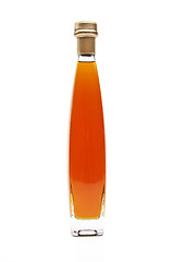 Image showing Alcohol cognac in a closed bottle on white background