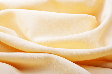 Image showing background of bright yellow silk with waves