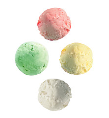 Image showing Four isolated scoops of ice cream from side