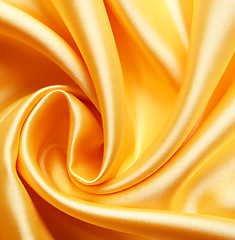 Image showing Smooth elegant golden satin as background 