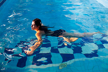 Image showing Attractive girl in swimming pool