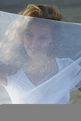 Image showing Young woman with white scarf