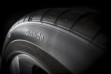 Image showing New tire from side with outside text