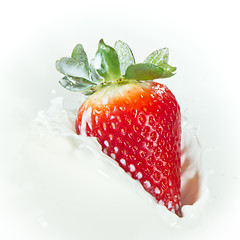 Image showing strawberry splashing into milk