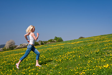 Image showing happy young woman on meadow