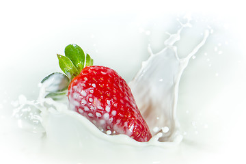 Image showing strawberry splashing into milk