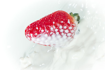 Image showing strawberry splashing into milk