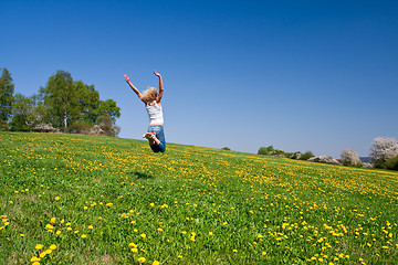 Image showing happy young woman on meadow