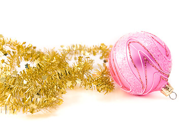 Image showing golden tinsel with pink glass decoration