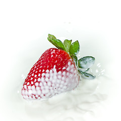 Image showing strawberry splashing into milk