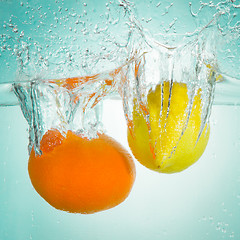 Image showing citrus fruit splashing