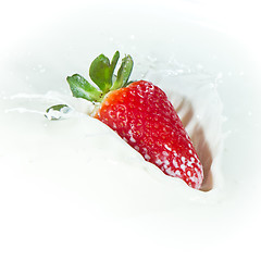 Image showing strawberry splashing into milk