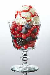 Image showing glass of fresh berries with ice cream