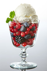 Image showing glass of fresh berries with ice cream