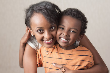 Image showing A young boy with his big sister