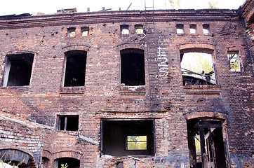 Image showing old abandoned building after fire. ladders windows 