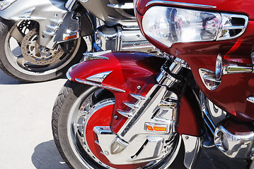 Image showing motor cycle engine and bike reflected in a chromium-plated surfa