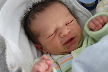 Image showing sweet baby sleeping on a blanket, newborn baby