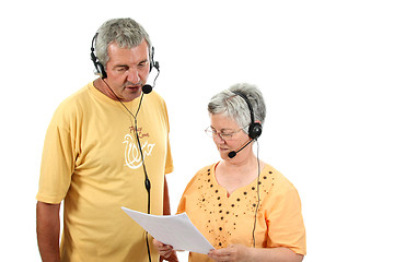 Image showing mature couple in a business call center