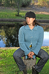 Image showing  beautiful woman in an autumn park 