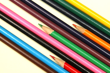 Image showing Assortment of coloured pencils with shadow on white background