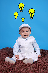 Image showing Portrait of a happy baby boy Isolated on blue background having 