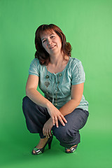 Image showing fashion woman on green background. studio shot.