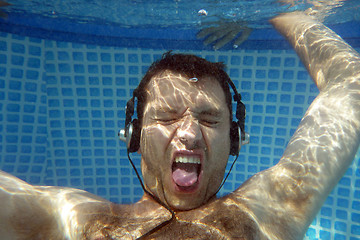 Image showing man underwater listen music with head-phones