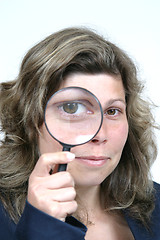 Image showing Young businesswoman holding Magnifying Glass, business photo