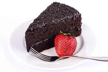 Image showing Slice of chocolate cake with strawberries.