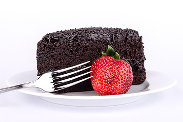 Image showing Slice of chocolate cake with strawberries.