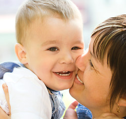 Image showing Portrait of a mother hugging her son