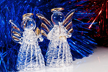 Image showing Two glass angel and Christmas tree tinsel