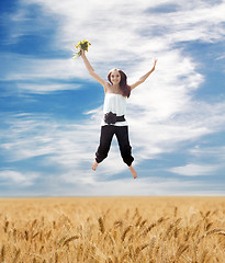 Image showing Flying Young Summer Woman