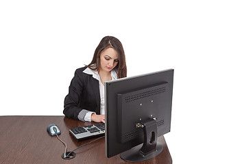 Image showing Young woman working on a computer