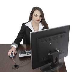 Image showing Young woman working on a computer