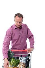 Image showing Mature man doing grocery shopping