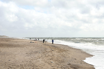 Image showing Anglers on Beach