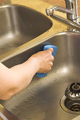 Image showing washing the sink