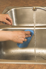 Image showing washing the sink