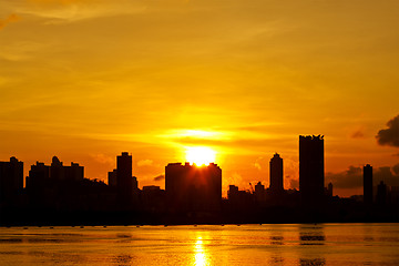 Image showing City at sunset along the coast