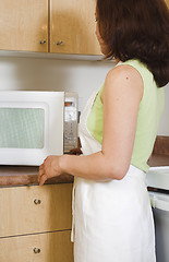 Image showing opening the microwave