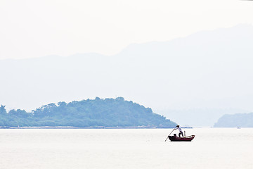 Image showing Fisherman over the mountain and the sea alone