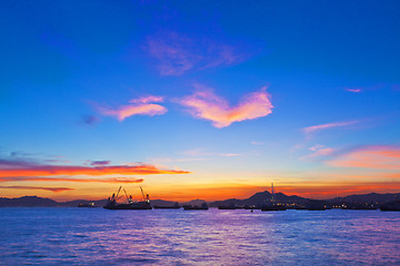 Image showing Sunset coast at cargo terminal