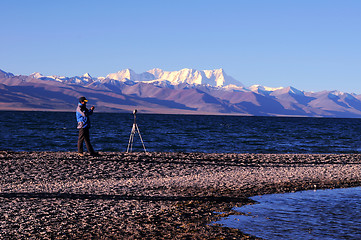 Image showing Landscape at lakeside with a photographer's silhouette